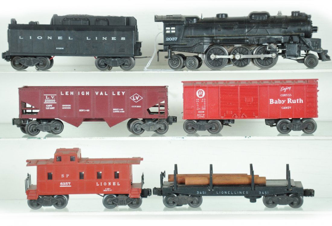 6Pc Lionel Steam Freight Set: Includes a 2037 loco; 6026W tender, broken front steps; 6014 boxcar; 3451 log dump; 6456 LV hopper; 6357 caboose. Otherwise all show light to moderate playwear, C7