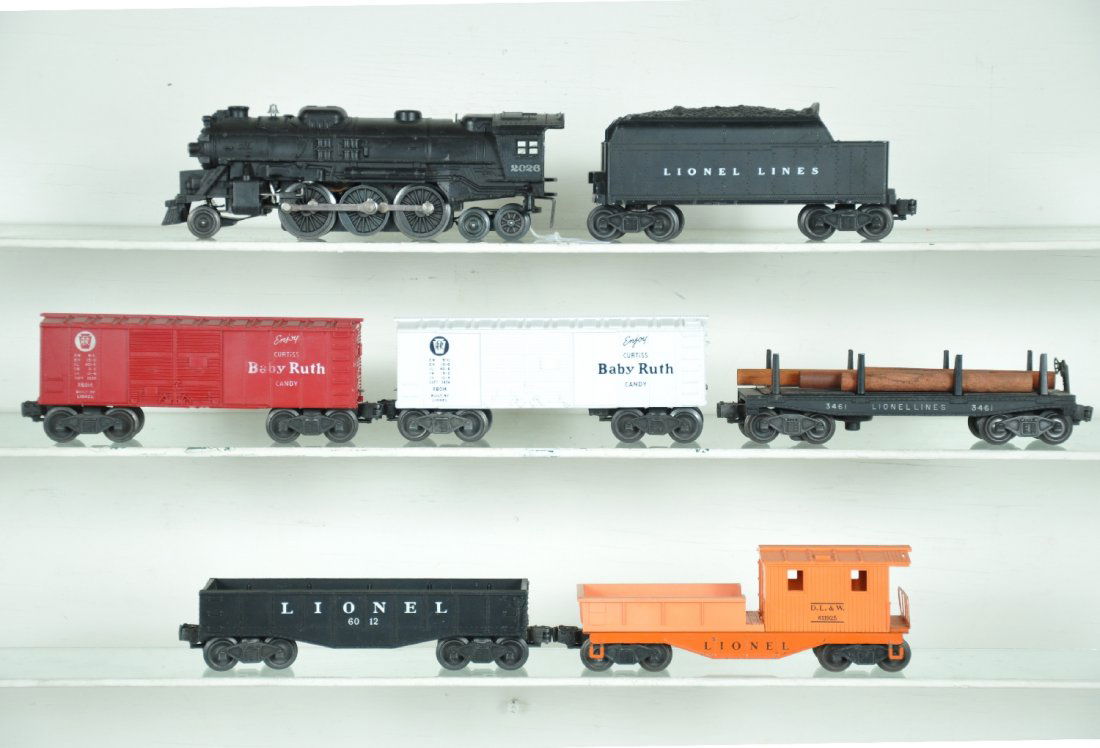 Clean 7Pc Lionel Steam Freight Set: Includes a 2026 loco, light oxidation on 1 rod, nice matte patina; matching 6466T tender; 3461 log dump, minor oxidation on platform; 2 #6014 BR boxcars; 6012 gondola; 6119-25 work caboose, missing st