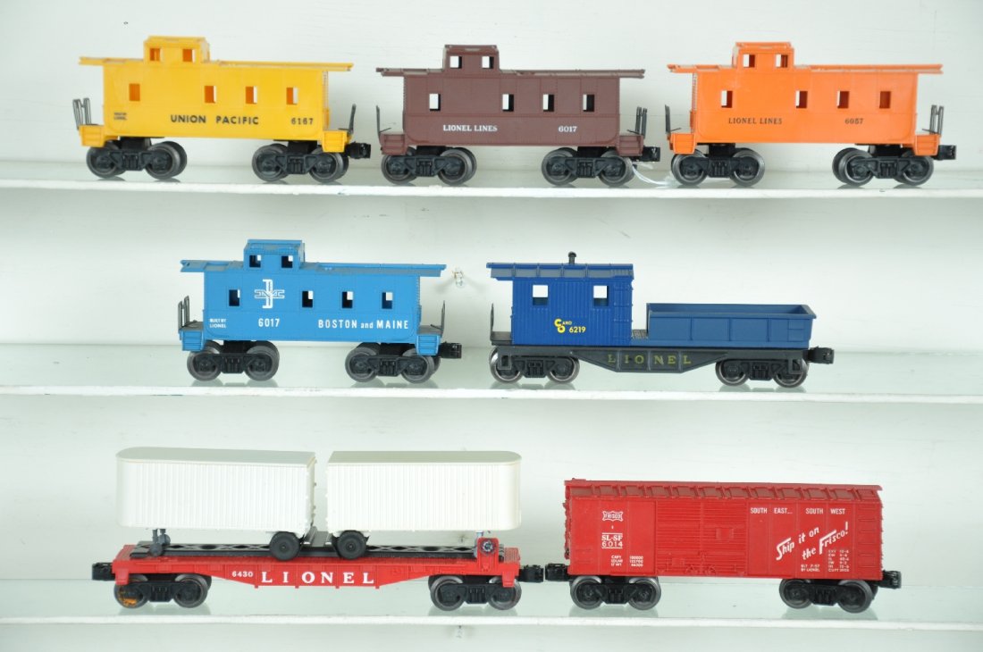 7 Clean Late Lionel Freight Cars: Includes a 6219 C&O work caboose; 6017-100 B&M caboose, unrun; 6430 flat with non-plated vans; 6014 Frisco boxcar; 6057 caboose; 6167 UP caboose; 6017 caboose. All show light playwear, C8