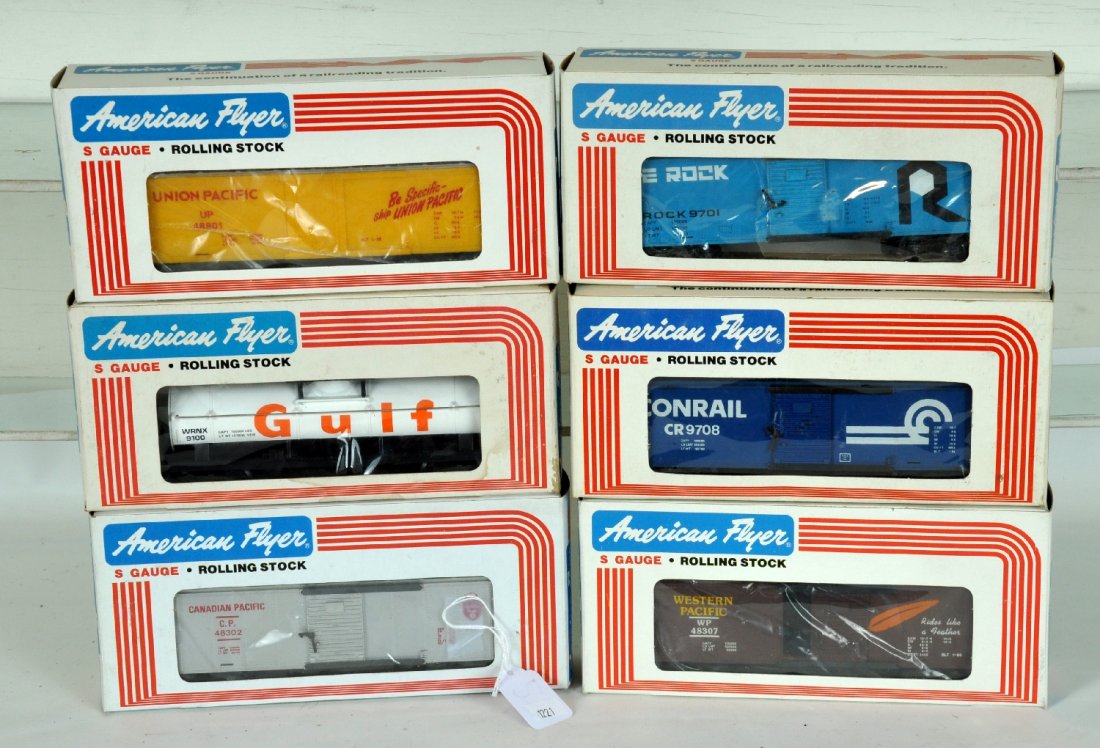 6 Lionel-American Flyer Freight Cars: S Gauge. Includes 48801 UP reefer; 9701 Rock boxcar; 161985 Custom Conrail boxcar; 9100 Gulf tank, ob some skinning; 48307 WP boxcar; 48302 CP boxcar. All appear unrun with boxes, C9