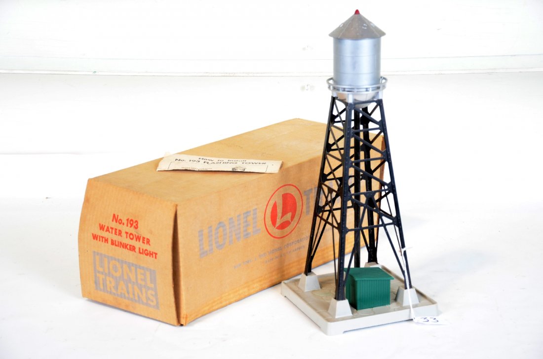 Scarce Boxed Lionel 193 Water Tank: This is the black superstructure version. It is clean and complete with instructions. It has the correct top-open box, but the binding tape has split. It shows light playwear, C8