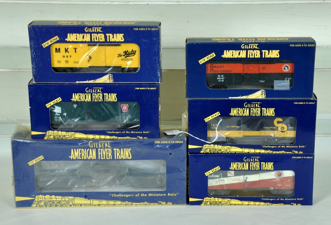 6 Lionel-American Flyer Freight Cars: S Gauge. Includes 48332 MKT boxcar; 48328 GN boxcar; 48531 Chessie flat with cable reel; 48347 C&O boxcar; 48348 NP boxcar; 48352 PRR Boxcar. All appear new in boxes, C9-10