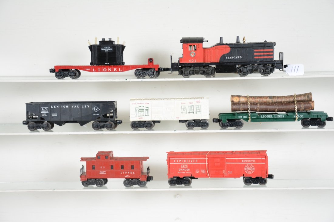 7Pc Lionel 602 Diesel Freight Set: Includes a 602 Seaboard NW2 switcher, screw chip and some oxidation on frame; 6818 flat with transformer; 6361 timber car, replaced chains; 6470 target car; 6050 savings bank car; 6176 hopper; 6257 ca
