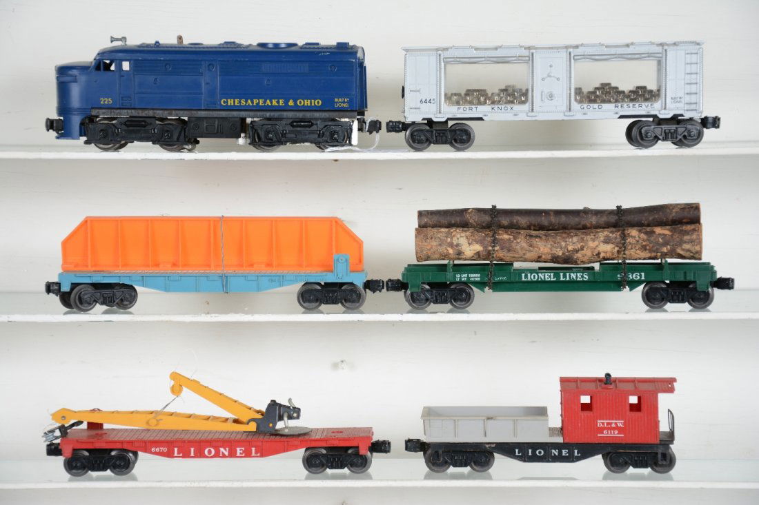 6Pc Lionel 225 Diesel Freight Set: Includes a 225 C&O Alco A Diesel; 6445 Fort Knox Gold bank car; (6802) flat with girder; 6361 timber car, some lettering wear from chains; 6670 flat with derrick; 6119-100 work caboose. All show light