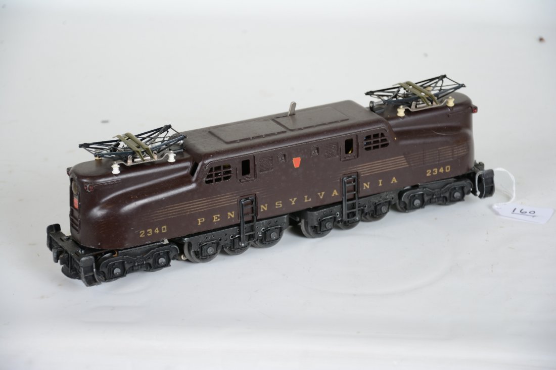 Lionel Tuscan PRR 2340 GG1: Dual motor Congressional electric. The stripes are about 30% over-all with 100% decals. It shows light to moderate playwear, C6-6+