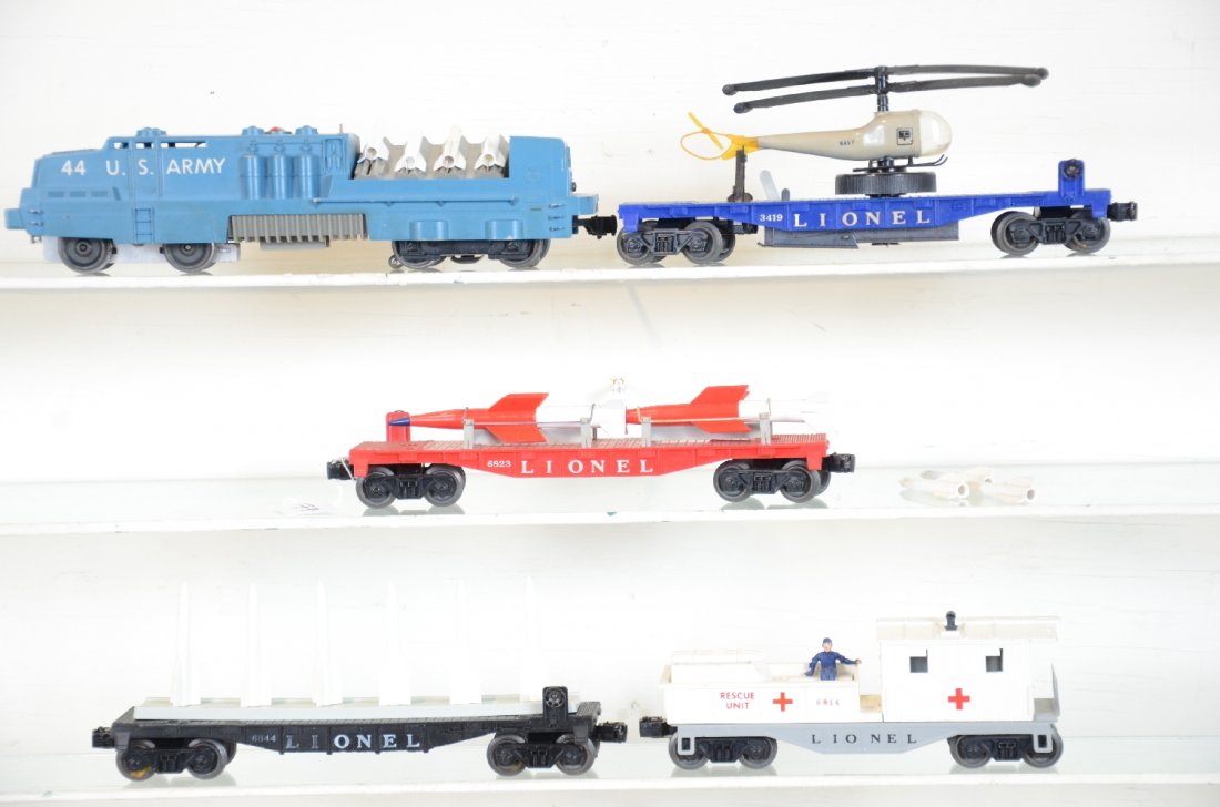 Lionel US Navy Set (2527): Circa 1959. includes a 44 Navy missile launcher with light box rubs and replaced figure; 3419 operating helicopter car with double blade copter; 6823 flat with missiles; 6844 flat with missiles; 6814 