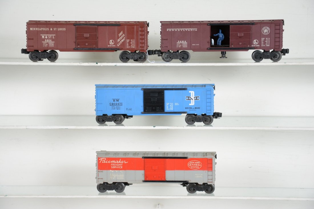 4 Lionel 6464 Style Boxcars: Includes 6464-125 NYC, type IIA, heat stamped, C6; 6464-475 B&M, type IIB, C8; 3484 PRR operating boxcar, C7+; 6464-50 M&StL, type I, with door guide oxidation, body, C8