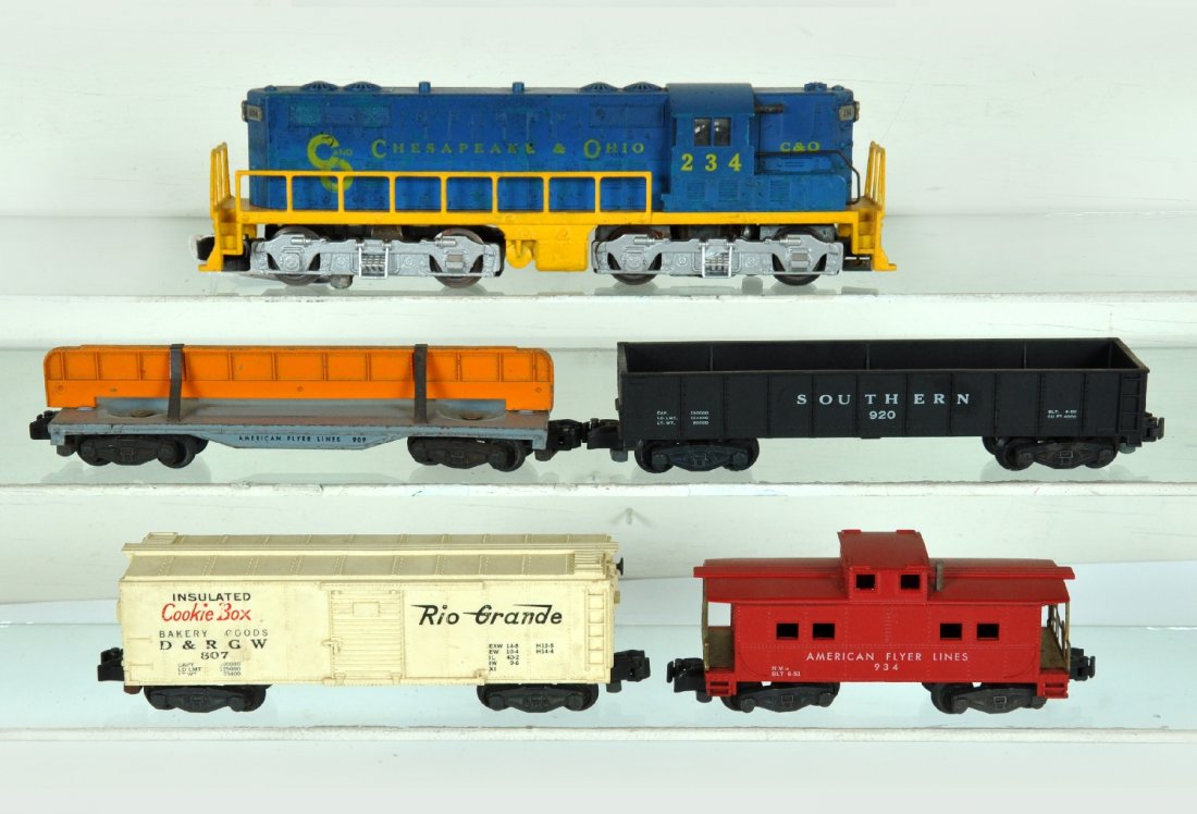 American Flyer 21234 Diesel Freight Set: S Gauge. Includes a 21234 C&O GP7 diesel, frame edges & rails repainted; 909 flat with girder; 920 Southern gondola; 807 Cookie Box; 934 caboose. All show moderate playwear, otherwise C6