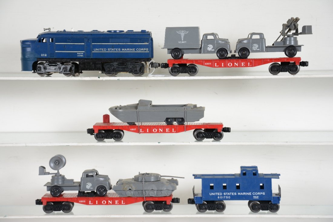 5Pc Lionel USMC Set (1591): Includes a 212 USMC Alco diesel, cowl repaired; 6803 flat with Pyro tank & sound truck, sound bracket marked "M"; 6807 flat with Pyro DKW; 6809 flat with Pyro hospital & gun turret truck.; 6017-50 USM