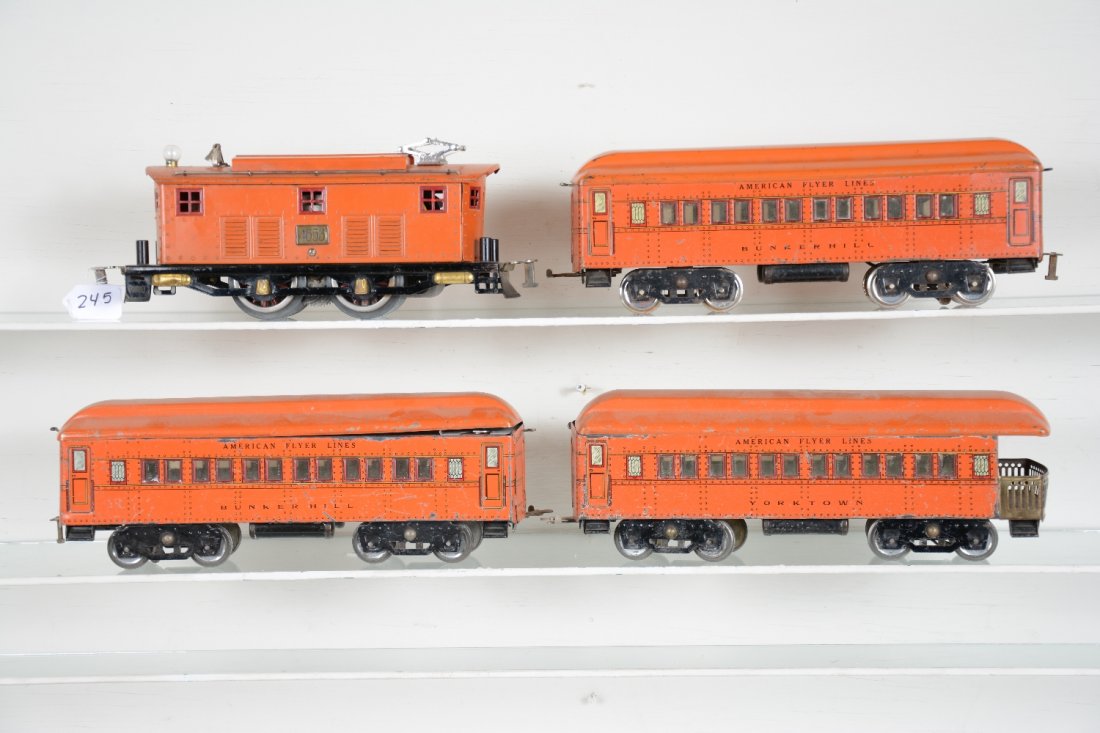 American Flyer Statesman Set: Standard gauge. Includes a 4653 boxcab electric, roof loose, missing light cover; 2 #4141 Bunker Hill Pullmans; 4142 York Town observation. All are fairly clean and color matches. They show moderate p