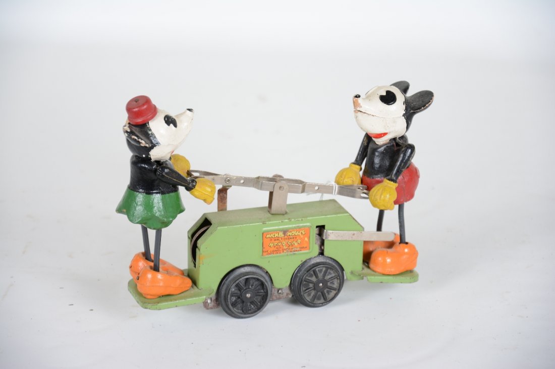 Lionel 1100 Mickey Mouse Hand Car: Scarce green base version with functional mechanism. The legs are replaced and missing tails. Minnie Mouse has a missing ear, but it is clean with nice figure paint. What is here appears C7-