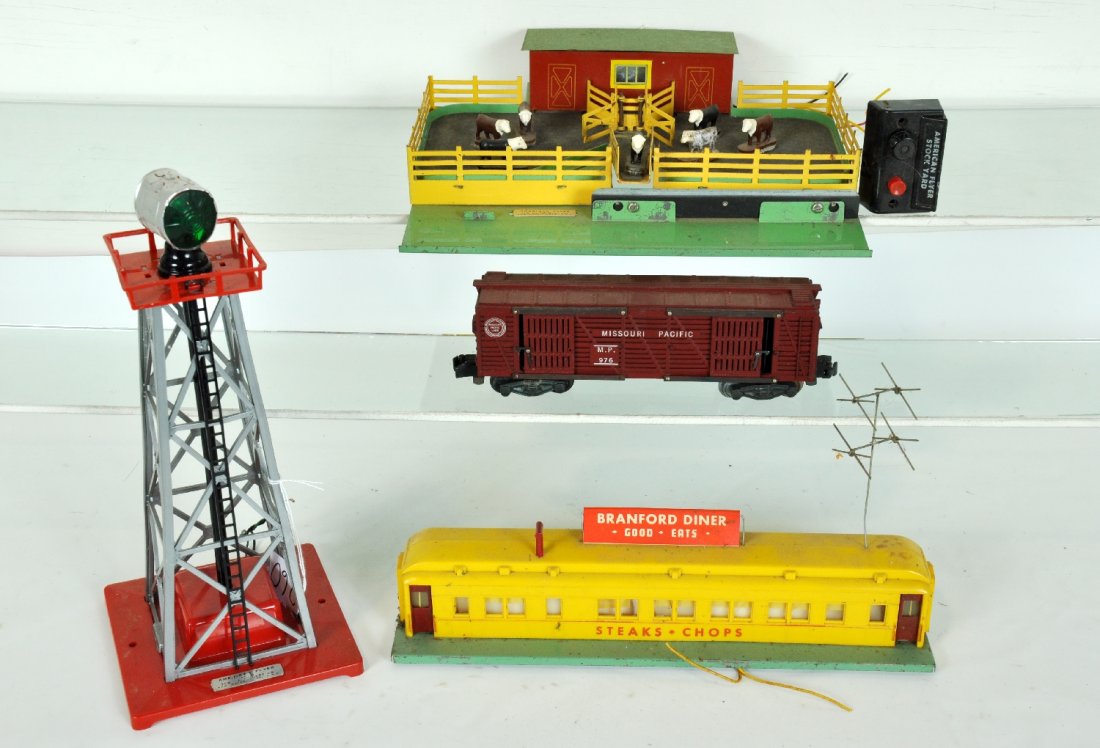 American Flyer K771, 769 & 767 Accessories: S Gauge. Includes a K771 stock yard with 976 operating car, cows & controller; 769 beacon; 767 Branford Diner. complete. All show light to moderate playwear, should clean to C7