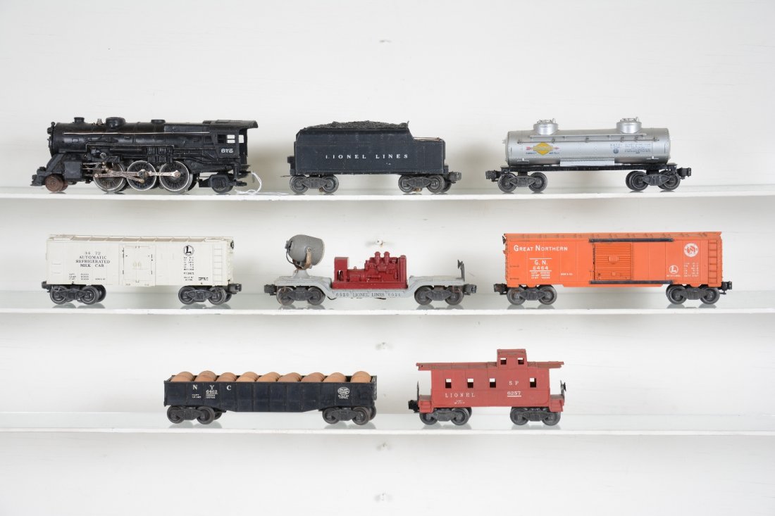 8Pc Lionel 675 Steam Freight Set: Includes a 675 steam loco, touched-up; 6466WX tender; 6464-25 GN boxcar, type I; 3472 operating milk car only; 6520 search light car; 6462 gondola with drums; 6465 Sunoco tank car; 6257 caboose. Rest 