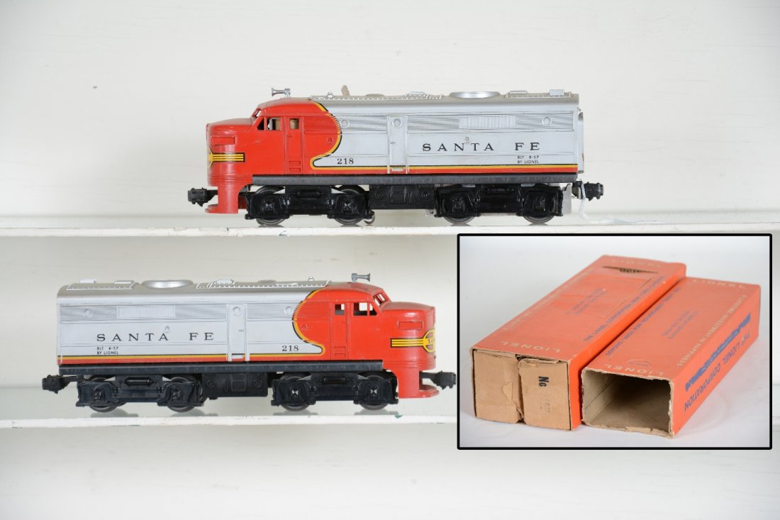 Clean Boxed Lionel 218 SF Alco AA Diesels: Nice matched pair with intact shells and strong decals. They have clean bright silver. Included are both boxes, power is intact with shop worn sleeve; trailer is missing flaps 1 side. Diesels are C8