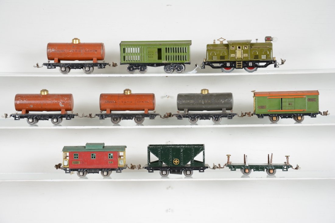10Pc Lionel 252 Train Set: Includes a 252 center cab electric, rewheeled, rewired and ready to run, C7; 4 #804 early tank cars; 821 stock car; 803 hopper; 831 lumber car, no load; 805 boxcar, missing brake wheel 1 side; 807 cab