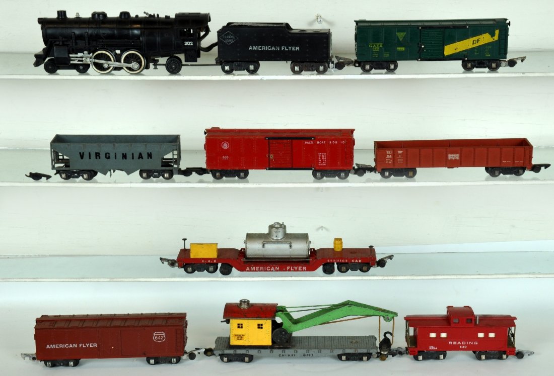 9Pc American Flyer 302 Freight Set: S Gauge. Includes a 302AC Reading Atlantic with smoke & Choo-Choo; 648 track cleaner; 635 crane; 641 Frisco gondola; (632) Virginian cast hopper, missing 2 steps; 622 GAEX boxcar; 642 reefer; 633 B&O 