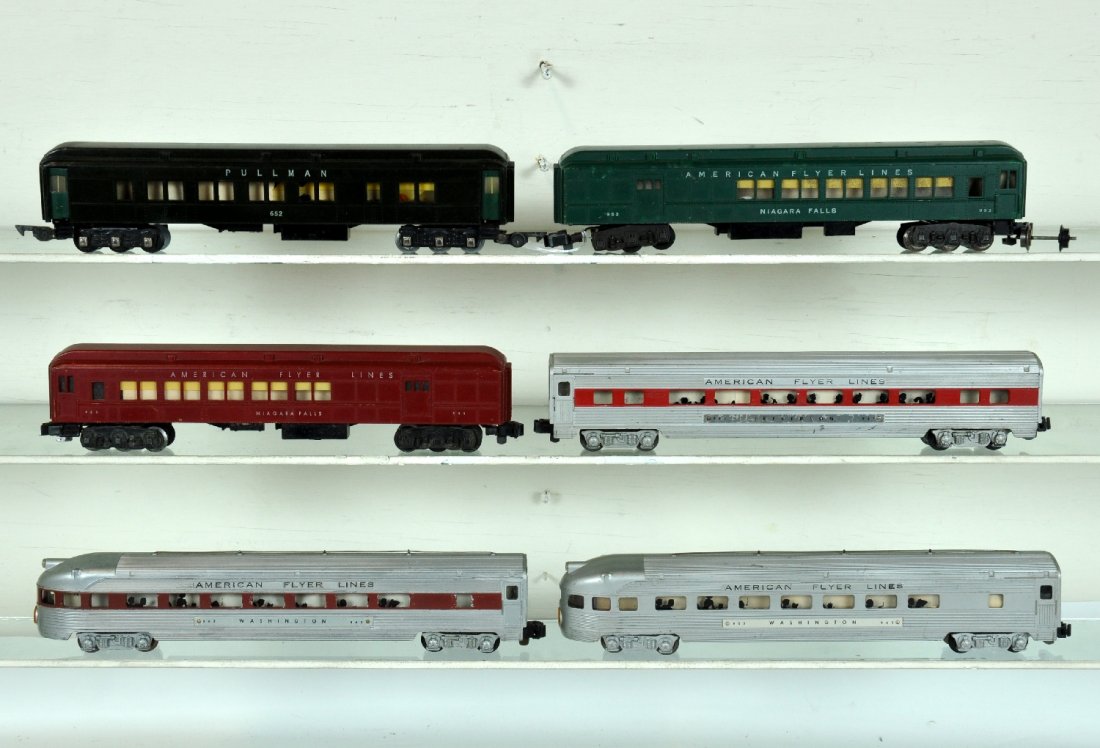 6 American Flyer Passenger Cars: S Gauge. Includes a 652 heavyweight Pullman, dark green; red & green 953 combines, 1 has loose wheel set; 961 red stripe coach; 963 chestnut observation, C5; 963 silver painted observation. Otherwise 