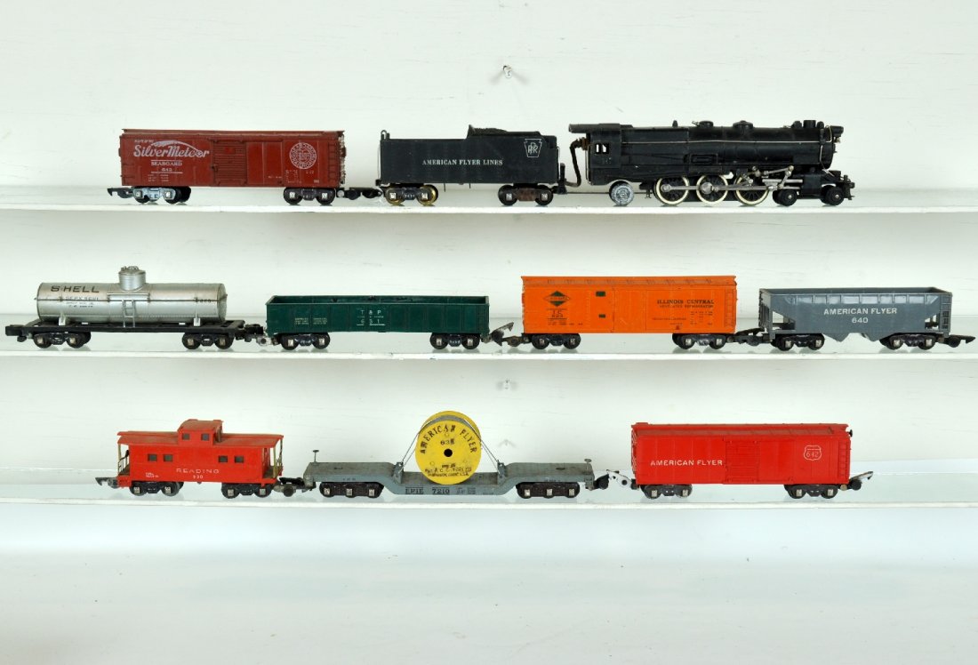 9Pc American Flyer 312 Freight Set: S Gauge. Includes a 312 PRR K4 locomotive, cab lettering off 1 side, missing 1 small front step; 642 Seaboard boxcar; 623 IC reefer; 631 T&P gondola, paint loss inside on edge; 640 hopper; 636 reel ca
