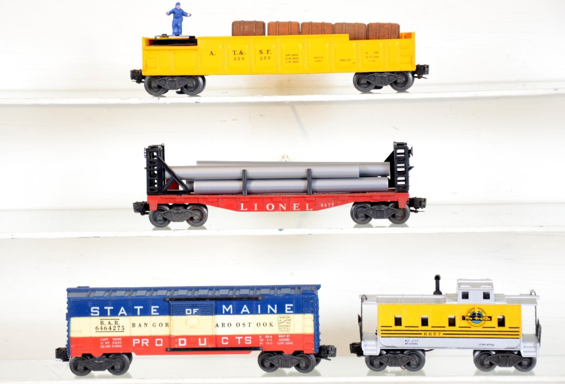 4 Clean Lionel Freight Cars: Includes a 6657 RG caboose, decals 98% 1 side; 90% other with added ladders, clean silver; 6464-275 SOM boxcar type IIA grooved; 3562-50 barrel car with 5 barrels, repro figure; 6477 bulkhead flat wit