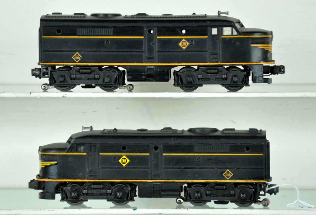 Lionel 2032 Erie Alco AA Diesels: Clean pair. Power shell has replaced nose decal and 1 side Erie decal. Some battery corrosion on bracket inside. They show moderate playwear, otherwise C6