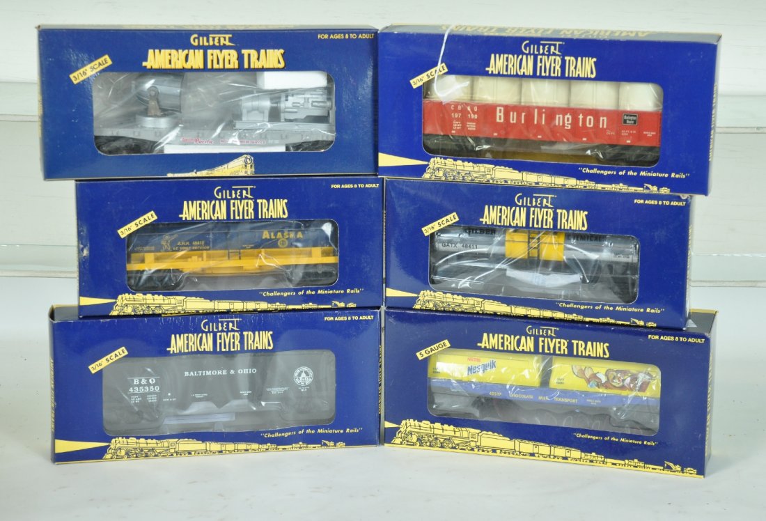 6 Lionel-American Flyer Freight Cars: S Gauge. Includes 48516SP searchlight; 48525 Burlington gondola; 48411 Gilbert's tank car; 48412 Alaska tank car; 48537 Nesquik container flat; 48620 B&O hopper. All appear unrun with boxes, C10