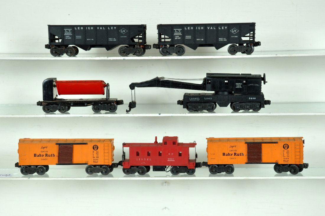7 Early Lionel Freight Cars: Includes a scarce 2357 caboose with red stack, missing tip; 2 #2454 BR boxcars; 2 #2456 LV hoppers; 3559 ore dump; 2460 crane, repaired boom supports. All show moderate playwear, otherwise C5+-6