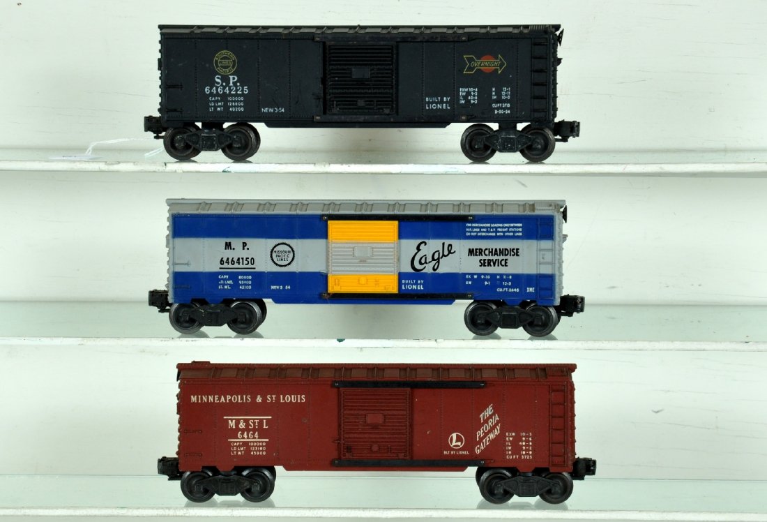 3 Lionel 6464 Boxcars: Includes a 6464-150 MP Eagle, type IIA, large Eagle, non grooved with striped door, C7+; 6464-50 M&StL, type 1, light oxidation on frame, chip in one ladder rung, C6 body; 6464-225 SP, type IIA with l