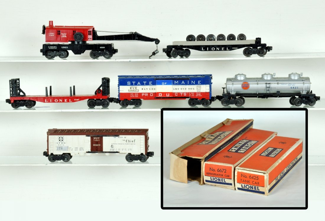 6 Lionel 1957 Freight Cars: Includes a 6467 bulk head flat car; 6560 crane, ob; 6672 SF reefer, black lettering, ob; 6464-275 SOM boxcar, grooved type IIA; 6425 Gulf Tank car, ob; 6262 wheel car. All show light to moderate playw