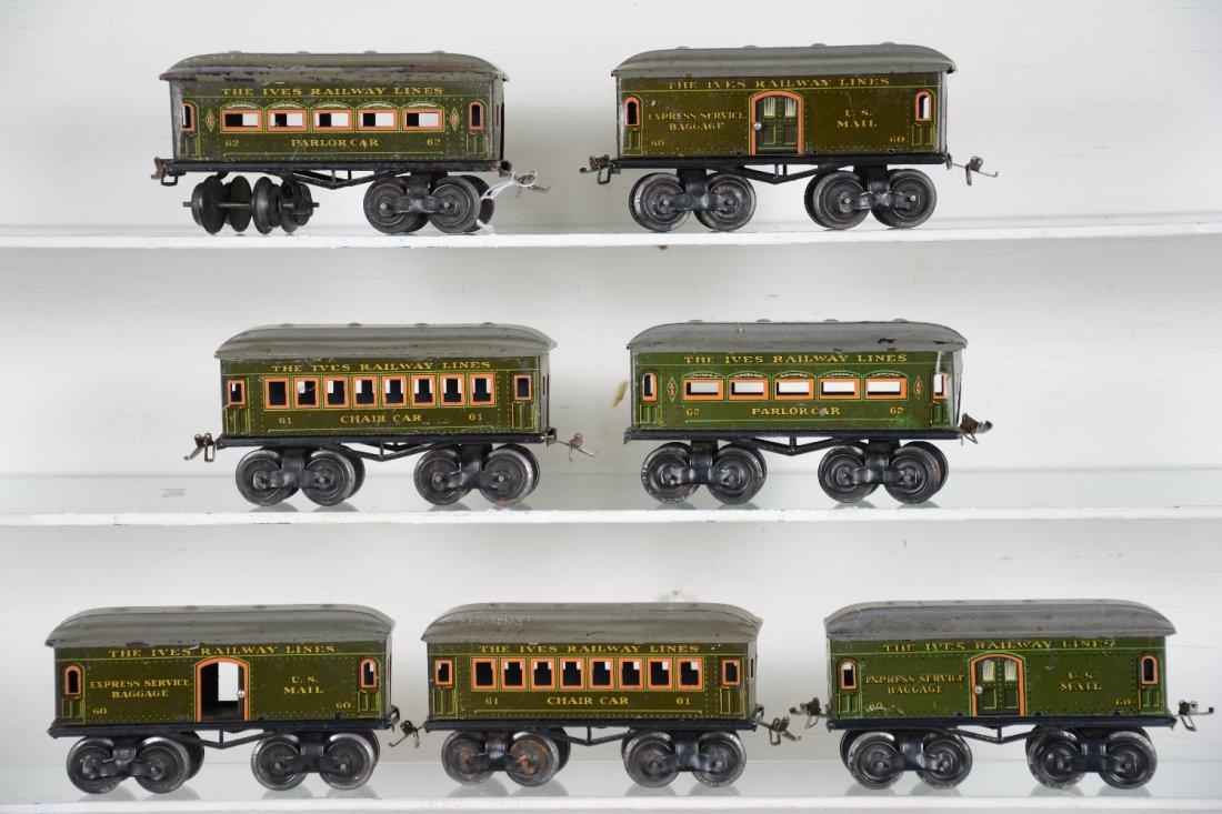 7 Ives T-Truck Passenger Cars: Includes 3 #60 baggage cars; 2 #61 Chair cars; 2 #62 Parlor cars, all have matching gray roofs, some flaking with t-Trucks. Bodies are clean & shiny, showing light to moderate playwear, C6-7