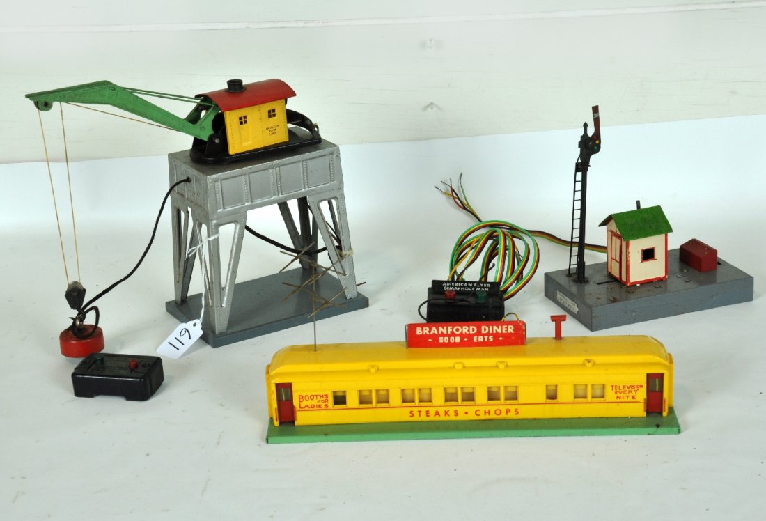 3 American Flyer Accessories: S Gauge. Includes a 767 Branford diner, complete, light oxidation on antenna; 758A Sam the Semaphore Man with controller; 583A electromagnetic crane with controller, needs wiring. All are fairly clean