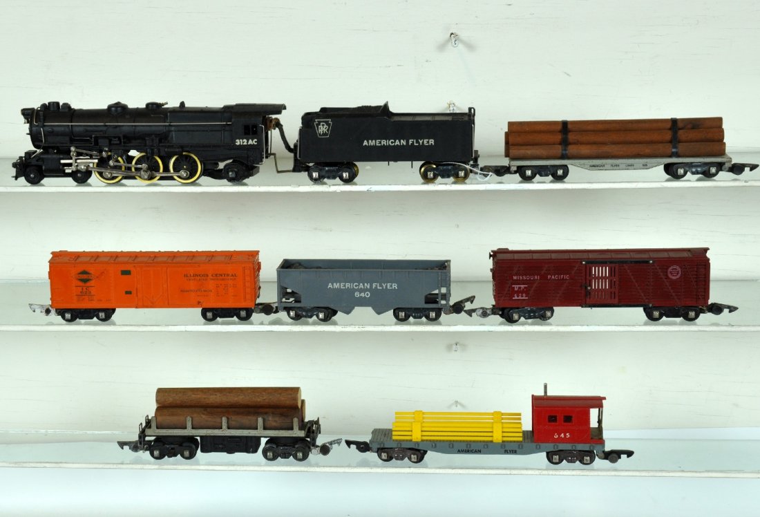 7Pc American Flyer 312AC Freight Set: S Gauge. Includes a 312AC PRR K-4 loco, clean with nice lettering & bright rods, C8; 623 IC reefer; 714 log dump car; 640 hopper; 629 MP stock, scarce filled in slats version; 605 log flat; 645 work c