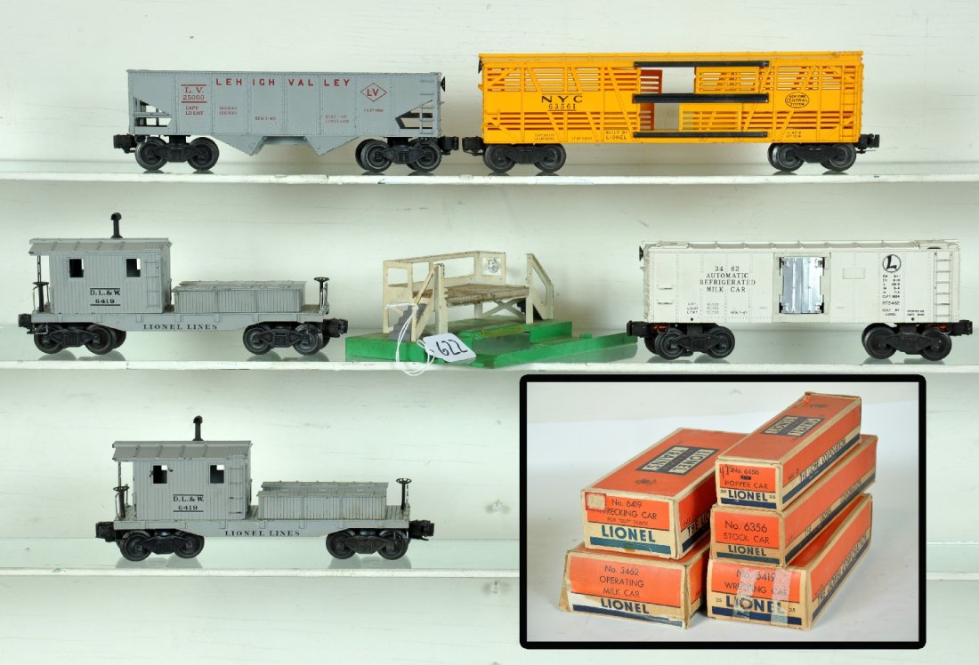 4 Boxed Lionel Freight Cars: Includes a 6356 NYC stock car; 3462 operating milk car with platform, 4 cans inside; 6419-25 work caboose; 6456-25 hopper; 6419 work caboose, hairline crack at stack, touched-up. All have boxes, some 