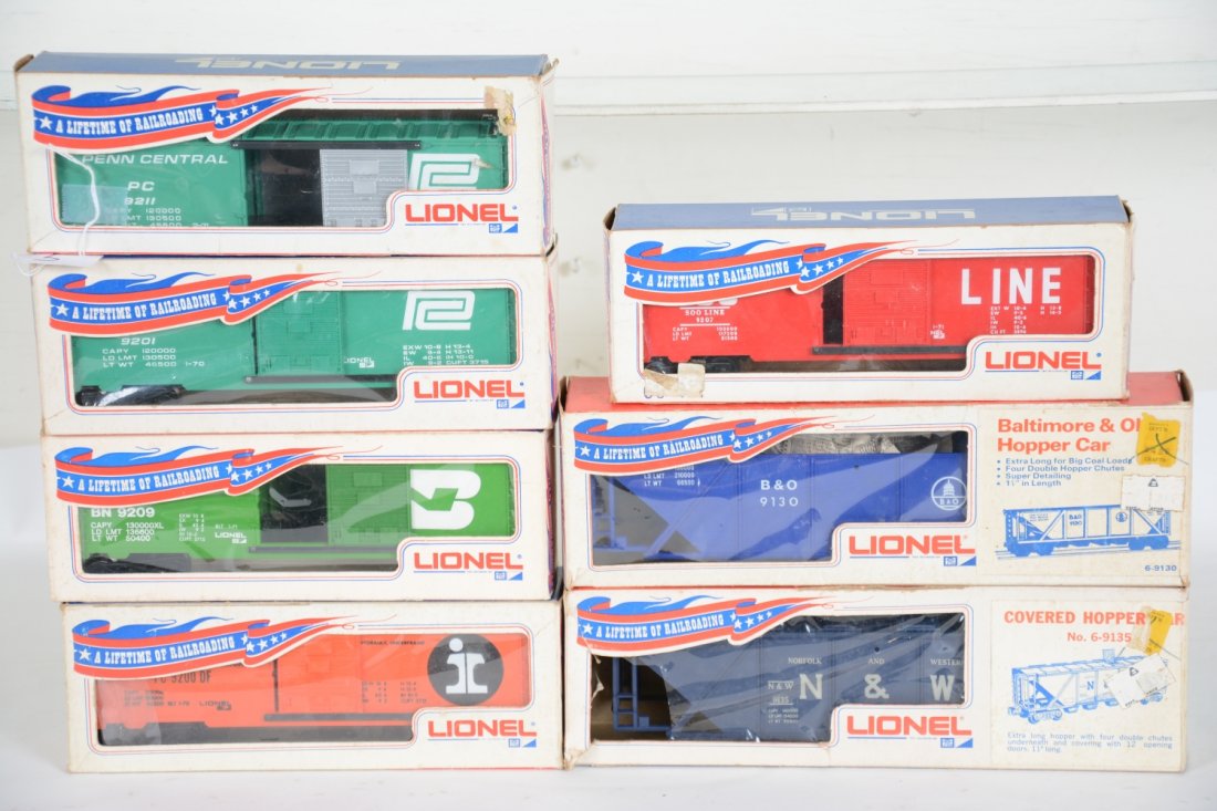 7 Boxed Lionel Freight Cars: Includes 9207 SOO boxcar; 9209 BN boxcar; 9130 B&O hopper; 9201 PC boxcar; 9135 N&W hopper; 9200 IC boxcar. All appear to be unrun or very lightly run with boxes, some worn, C9-10