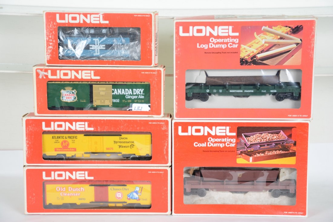 6 Boxed Lionel Freight Cars: Includes 9181 B&M caboose; 7872 Canada Dry boxcar; 9875 A&P reefer; 9870 Dutch Cleanser reefer; 9398 coal dump; 9238 log dump. All appear unrun with boxes, some scuffed, C10