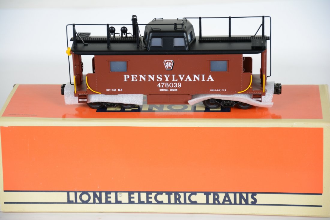 Lionel 51702 PRR Brass N8 Caboose: Made for the Turbine in lot 47. Has brass body and diecast copula and trim. It is equipped with puffing smoke and light. It is mint in box, C10