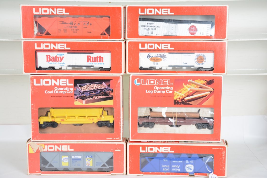 8 Lionel Freight Cars: Includes 9116 Domino Hopper; 9260 Reynolds hopper; 9311 coal dump; 9335 log dump; 9112D&RGW long gondola; 9854 BR reefer; 9860 Gold Medal reefer; 9855 Swift's reefer. All appear unrun with boxes, some