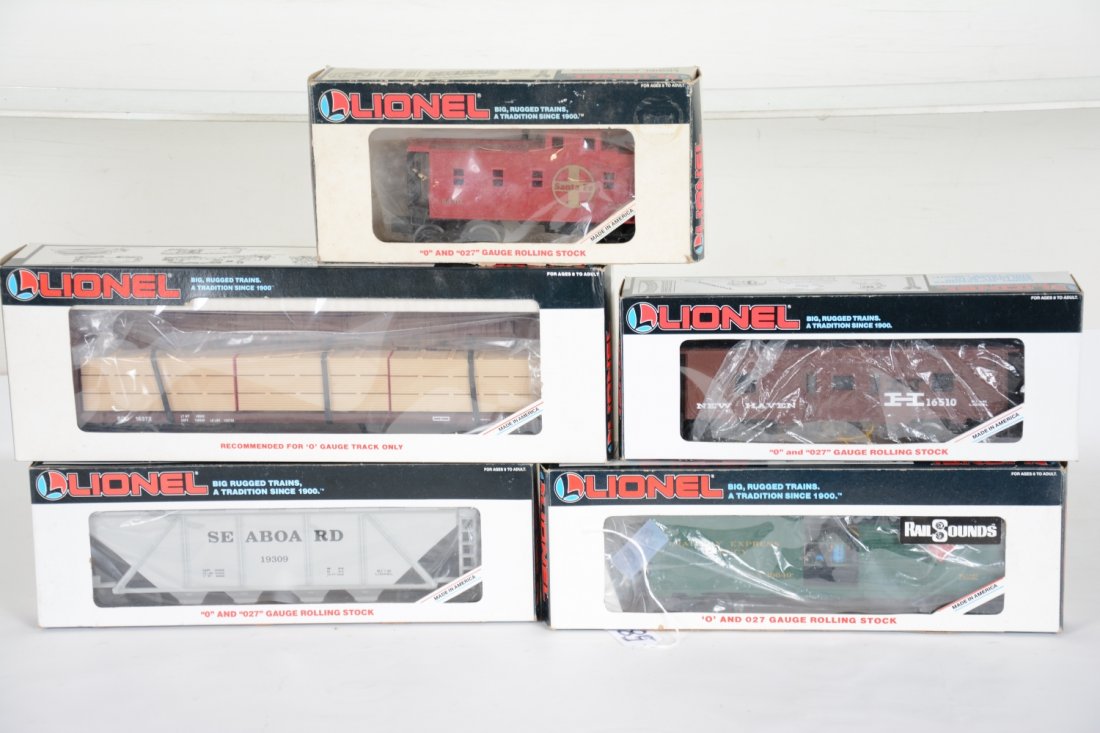 5 Lionel Freight Cars: Includes 16649 REA boxcar with steam ProtoSounds; 19309 Seaboard hopper; 6430 SF caboose; 16372 lumber car; 16510 NH baywindow caboose. All appear unrun with boxes, 6430 worn, C9+