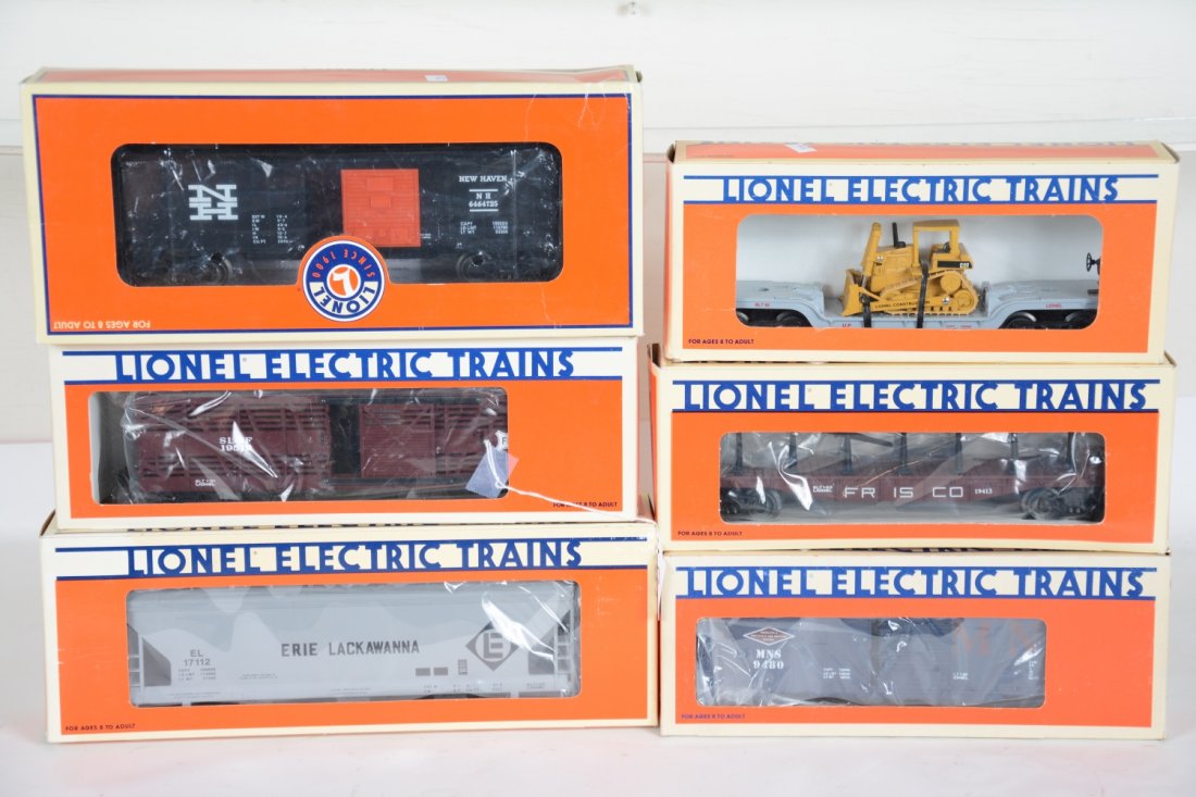 6 Boxed Lionel Freight Cars: Includes 16935 flat with dozer; 39204 NH boxcar; 9480 MN&S boxcar; 19413 Frisco stake flat; 17112 Erie center flow hopper; 19519 Frisco stock car. All appear unrun with boxes, C10