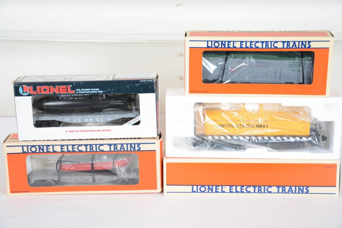 Lionel US Navy Set Extension Cars: Includes an 18938 USN non powered calf unit; 16710 missile car & 16351 flat with sub; 16939 USN flat with boat. They are unrun with boxes, C10