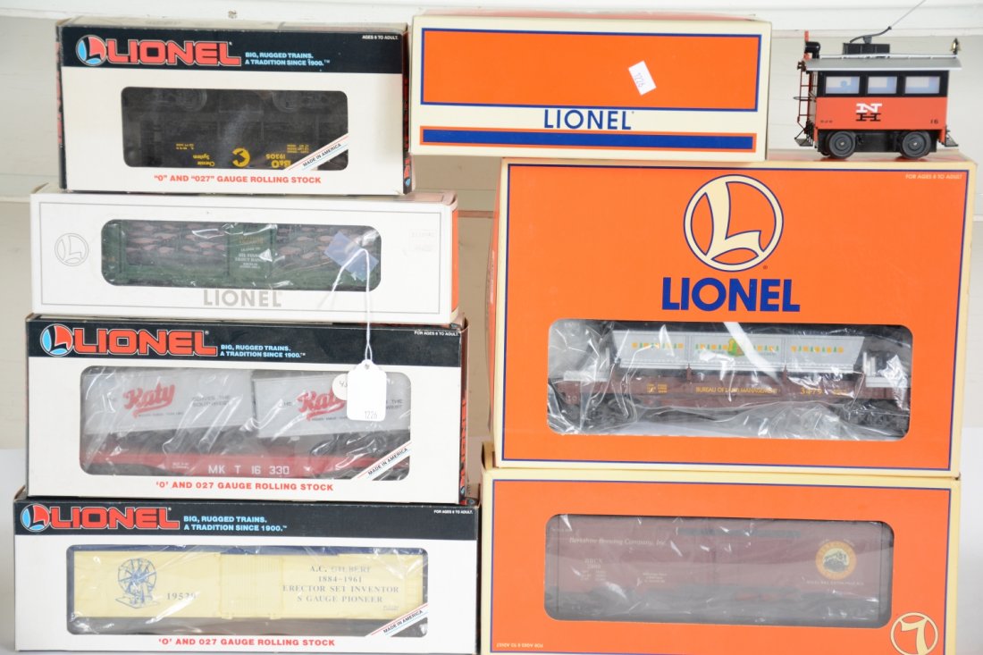 7Pc Lionel Lot: Includes 16766 Land Management operating ore car set; 16330 MKT trailer flat; NETCA Berkshire Brewing reefer; 19305 Chessie ore car; 19529 Gilbert reefer; 16742 aquarium car, box faded; 18482 NH rail 