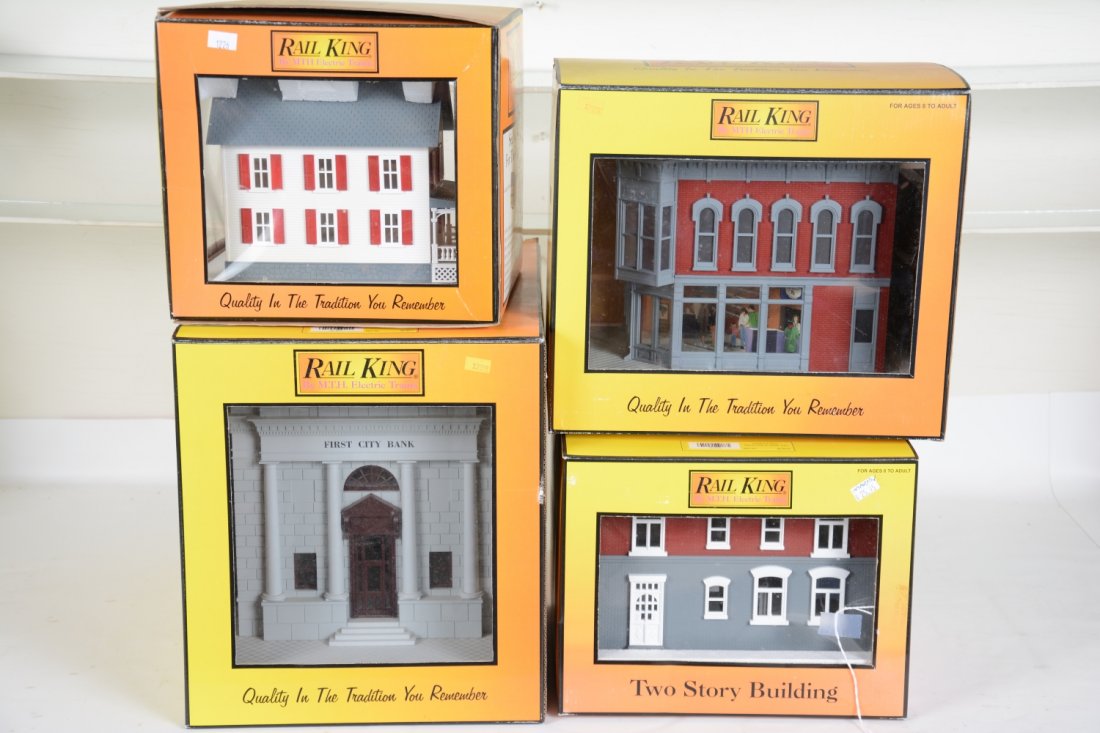 4 MTH RailKing Accessories: Includes 30-9018 hardware store; 30-9012 corner drug store; 30-9017 1st City bank; farm house. All show light use with boxes, C8+-9