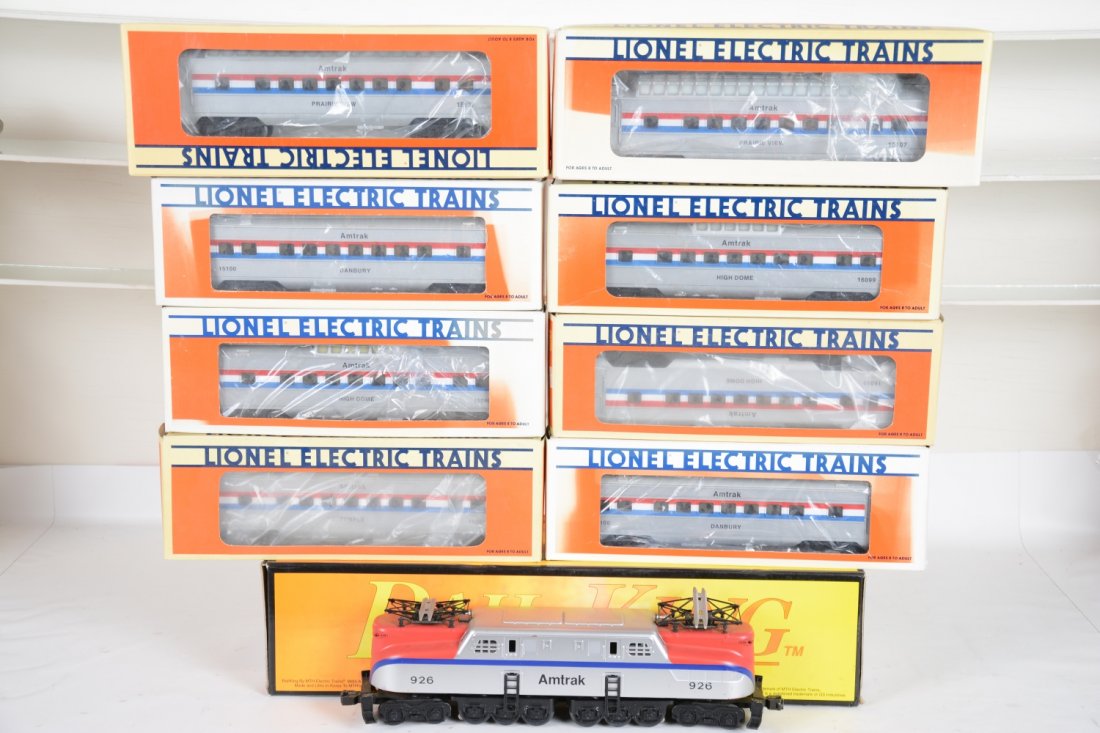 MTH & Lionel Amtrak Passenger Set: Includes an MTH RailKing RK-2502 GG1; Matching Lionel cars- 16098 coach; 3 #16099 vista-domes; 15100 coach; 2 #15107 full vista-domes. All show light to moderate playwear with boxes, C7-7+