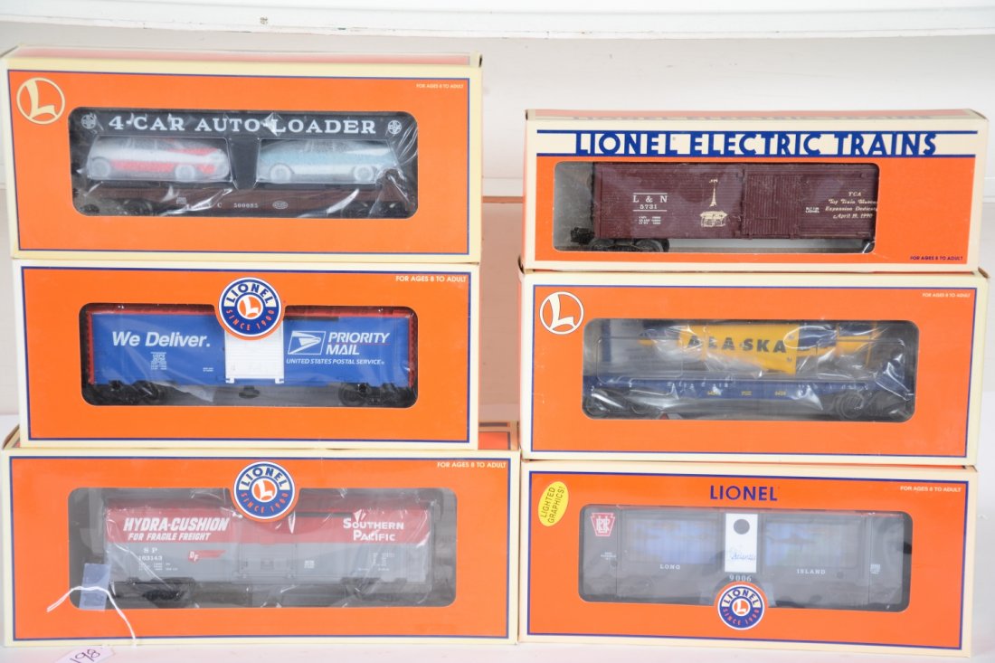 6 Boxed Lionel Freight Cars: Includes 5731 L&N reefer; 52433 LI RRC aquarium car; 36728 SP walking brakeman car; 19489 Evans auto-loader; 36021 flat with Alaska plane; 26766 Priority operating boxcar. All are mint with boxes, C10