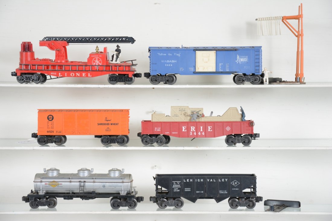 6 Lionel Freight Cars: Includes a 3424 brakeman car with telltale set, man broken off; 3444 cop & hobo car, some fading; 3512 fire ladder car, broken; 6456 hopper; 6415 tank car; 6024 Shredded Wheat boxcar. All show moderat