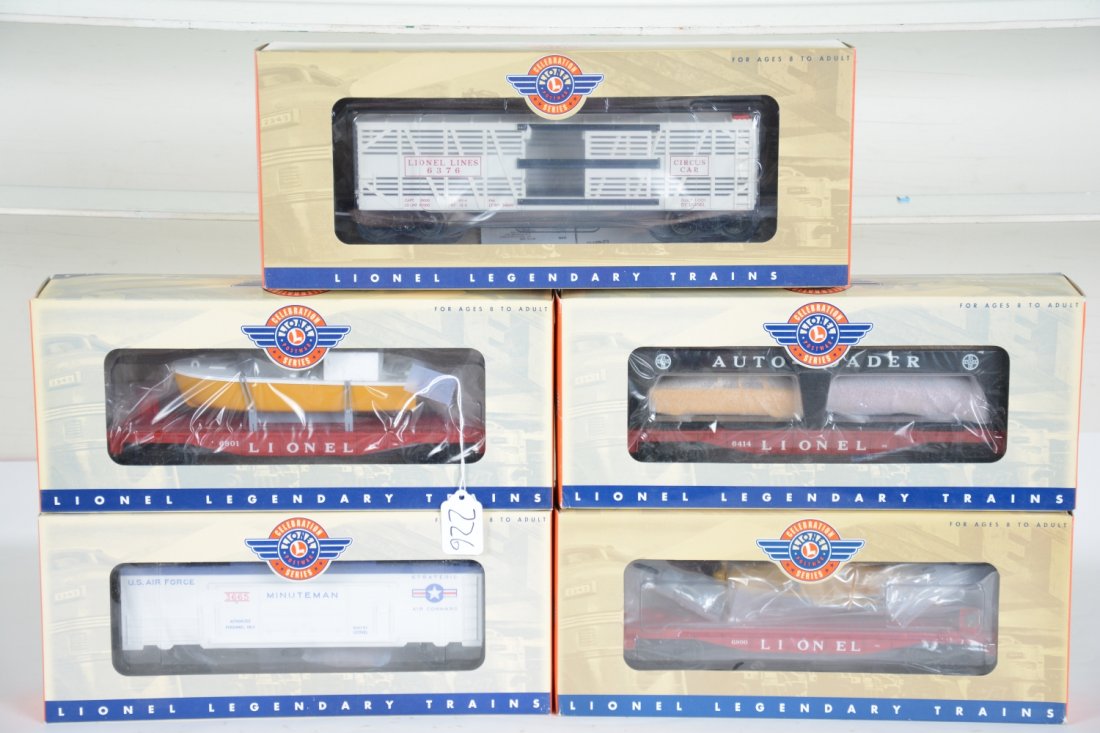 5 Lionel Celebration Series Freight Cars: Includes 19487 #6800 flat with airplane; 29463 #6414 auto-loader; 26048 #6801 flat with boat; 26762 #3665 Minuteman launcher; 19557 #6376 Circus car. All are mint in box, C10