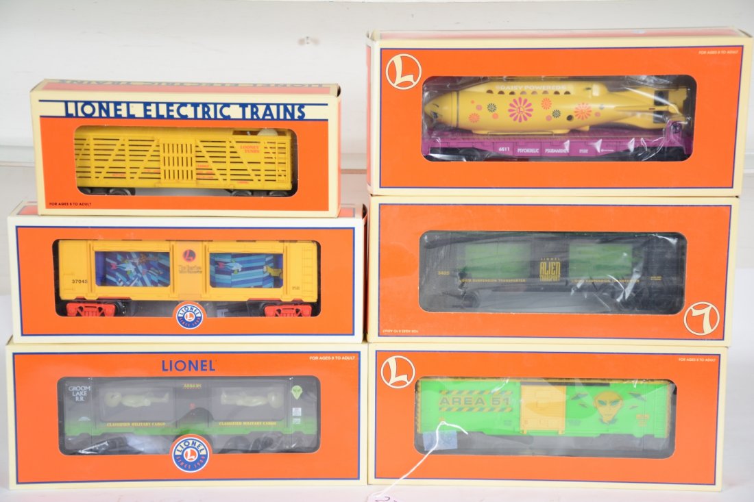 6 Lionel Novelty Freight Cars: Includes 37045 Beatles Sub car; 26709 Psychedelic sub car; 16662 Buggs bunny Outlaw car; 16793 Alien boxcar; 19869 Alien Transport aquarium car; 29606 Alien suspension car. All are mint in boxes, C10