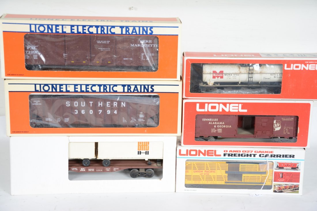6 Lionel LCCA Freight Cars: Includes 9728 UP stock car; 9727 TA&G boxcar; Monsanto tank car, dirty, C7; 52090 PM boxcar; 52038 Southern hopper; 9212 piggy back flat, dusty. Rest appear unrun with boxes, C9-10