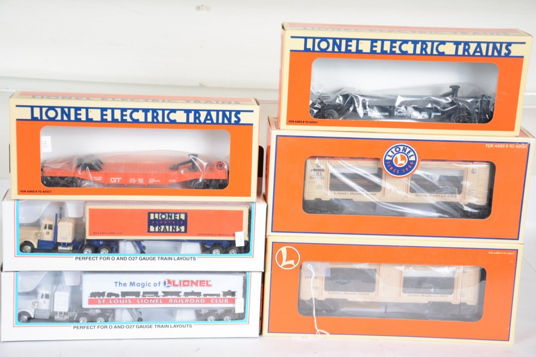 4 Lionel Commemorative Cars: Includes 52099 & 52040 TTOS flat with tractor trailers; 19671 model display car; 19675 model shop mint car #2. All are mint with boxes & 2 shippers, C10