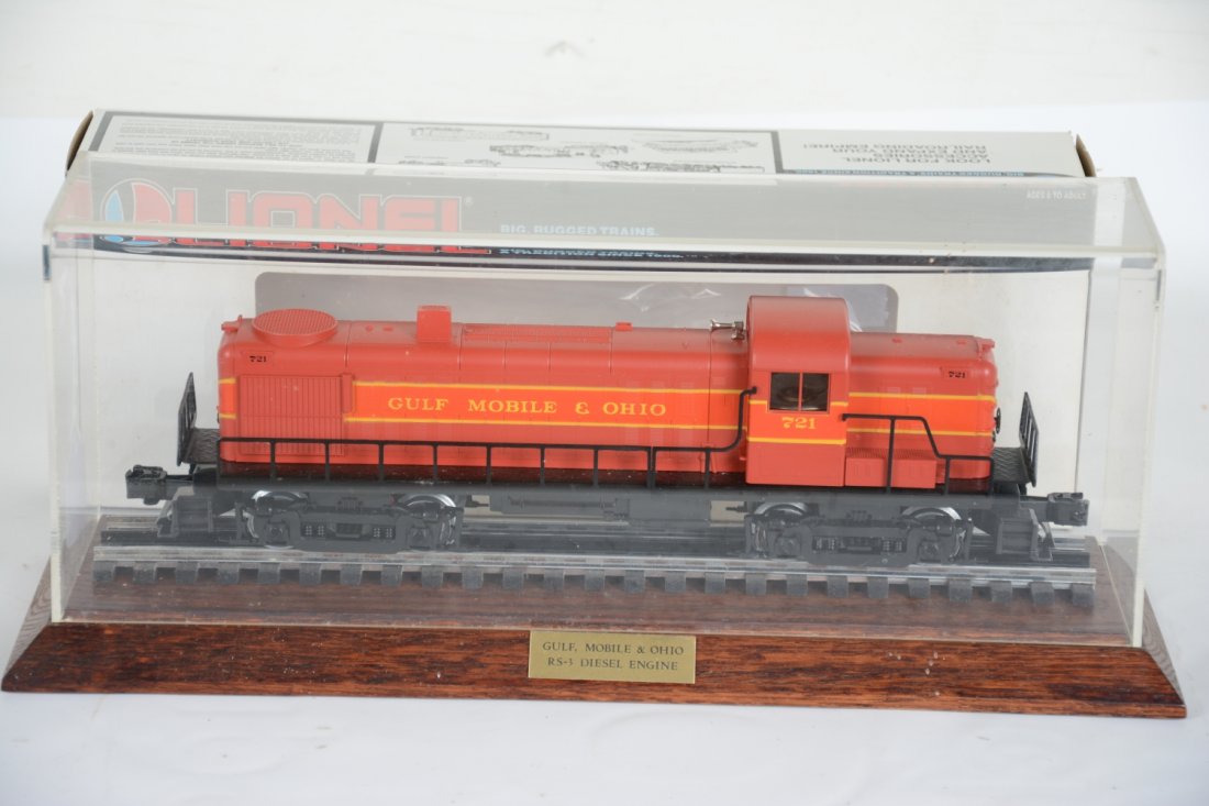 Lionel JC Penney 18554 GM&O Diesel & Case: Exclusive for JC Penney catalog. Nice limited production diesel with dual motors, light & horn. It has its Plexi display case and box for loco. It is unrun, C9+