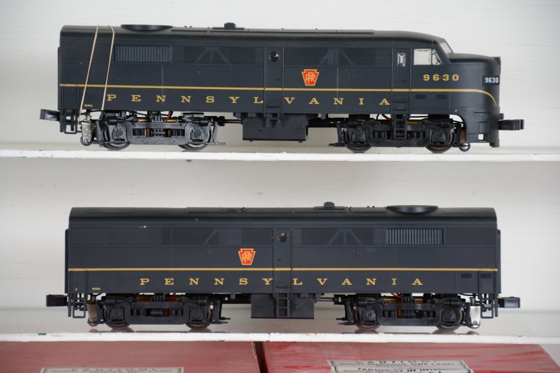 Weaver PRR FA-2 AB Diesels: Fairly clean set, ornamental horns in box. Power A shell loose, but they are intact, showing light runtime with worn boxes, C8